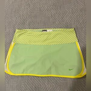 Nike dri-fit tennis skirt. Size M (8-10) 12” long with built-in shorts.